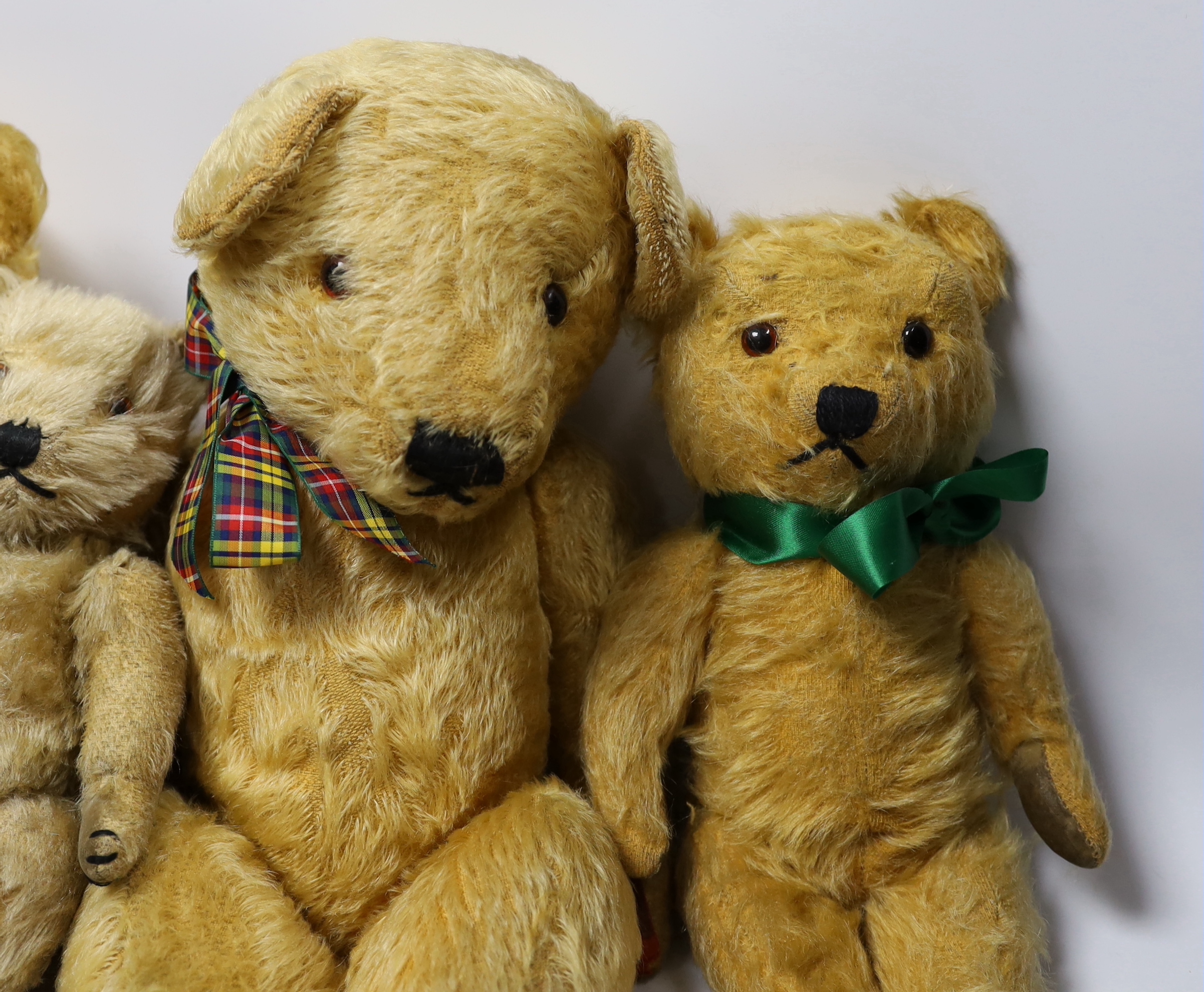 Three Chilterns bears, 1950's, worn, and a large English bear, 42cm (4)